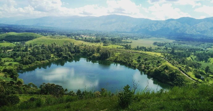 high-angle photography of lake at the forest